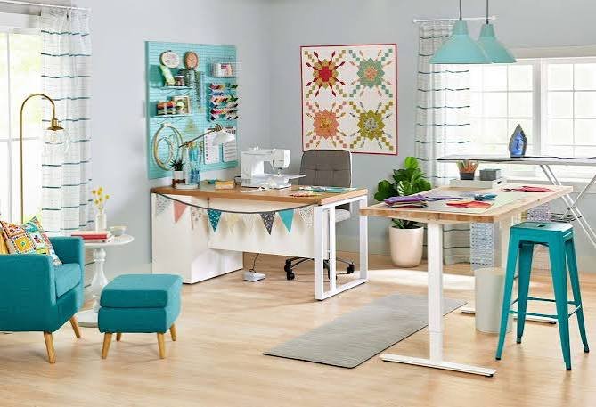 Sewing workspace with sewing machine, fabric and sewing supplies